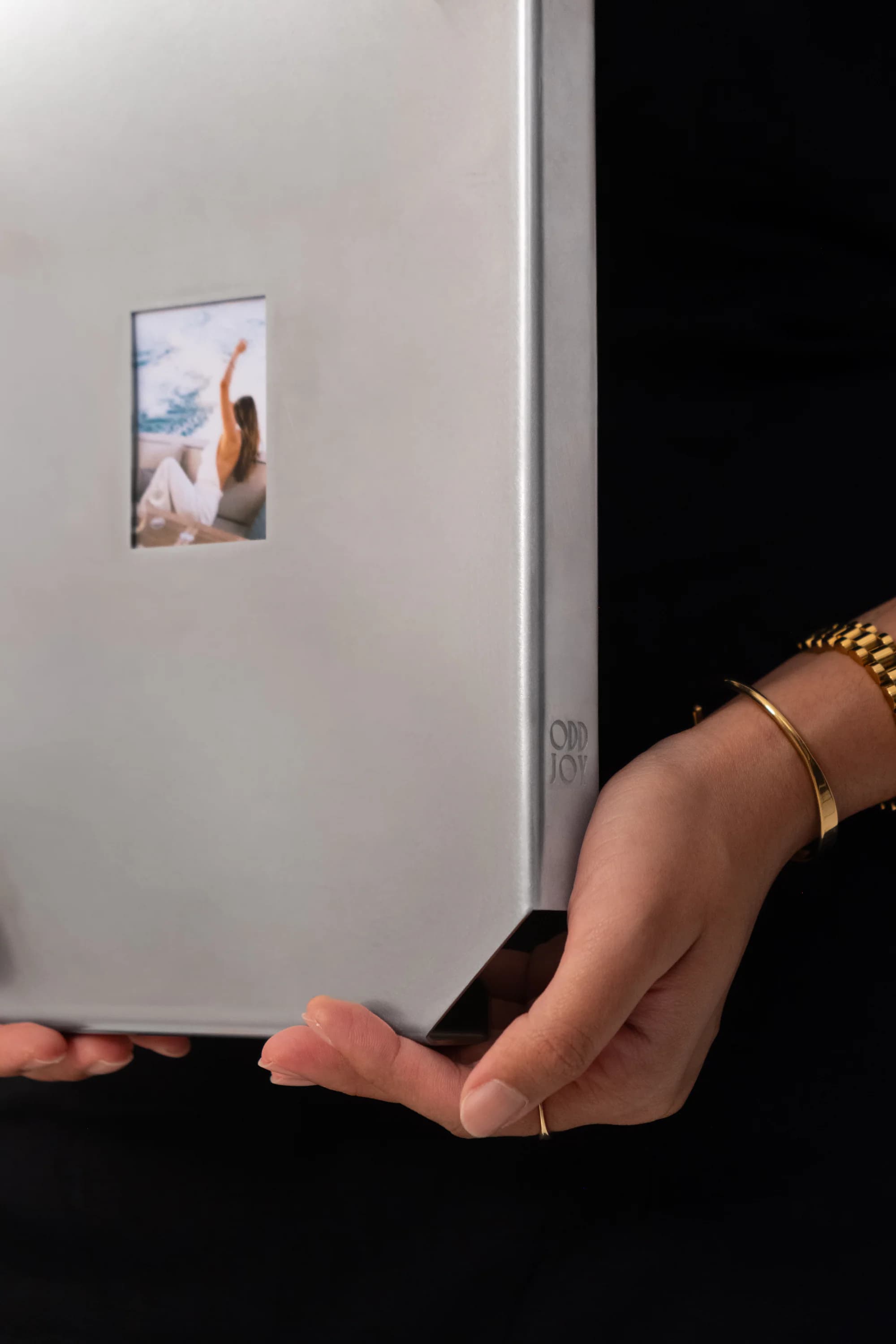 Relic 01 held upright with a photograph inside