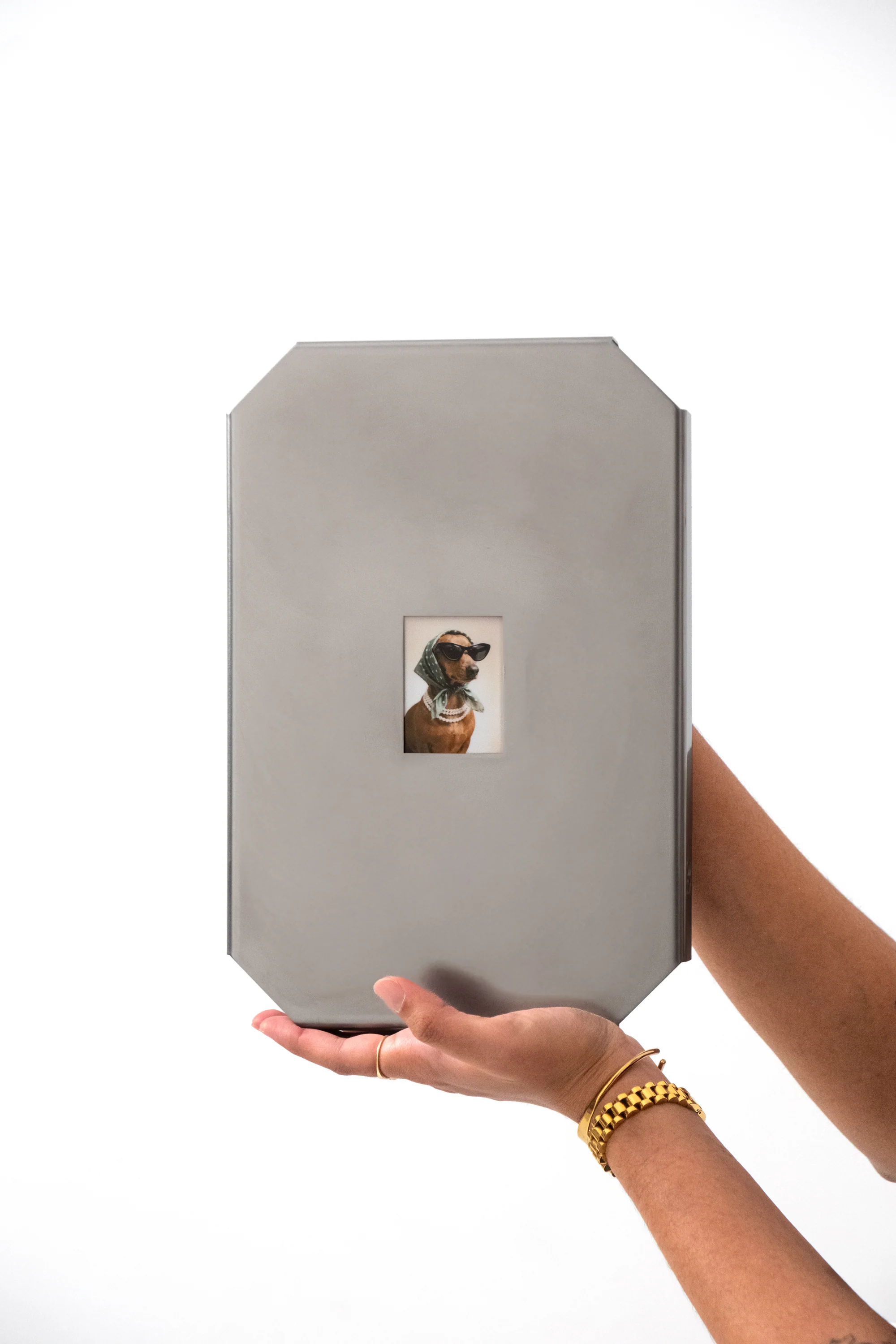 Oddjoy Memory Frame balanced on one hand